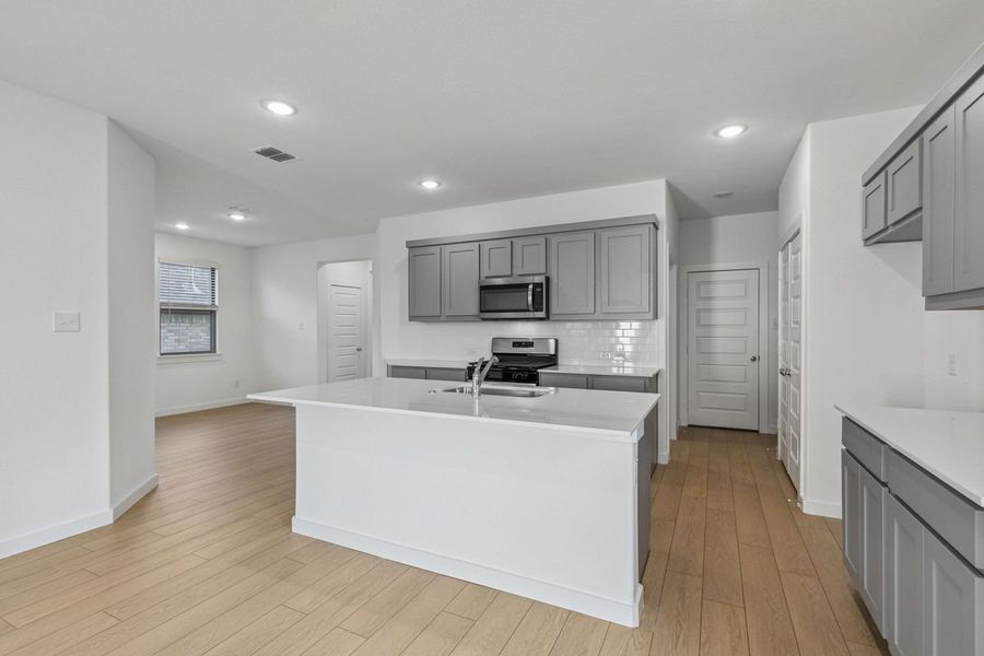 Kitchen in the Oak II home plan by Trophy Signature Homes – REPRESENTATIVE PHOTO