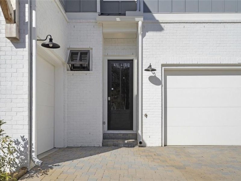 Exterior details and patio area of a home in The Village at Towne Lake, Woodstock (Image 1).