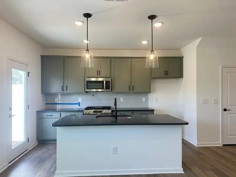 Kitchen featuring the AW Collection® Rosemary - Matte black, light wood, and garden-inspired style.