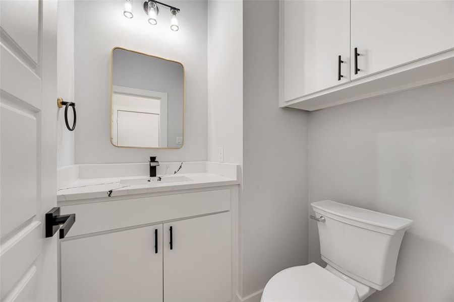 Bathroom featuring vanity and toilet Bathroom featuring vanity and toilet