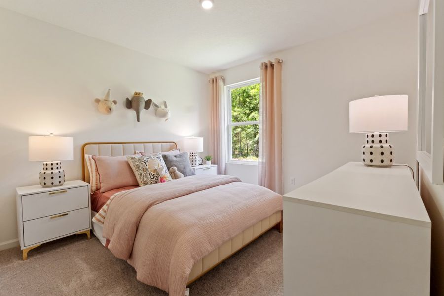 A bedroom with a bed and lamps. A bedroom with a bed and lamps.