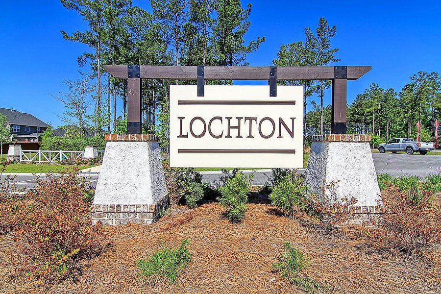 Front exterior of a new home in Lochton, Summerville, SC, highlighting curb appeal (Image 1).