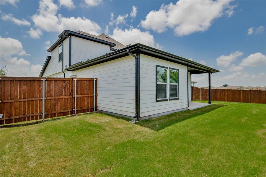 View of home's exterior with a fenced backyard View of home's exterior with a fenced backyard