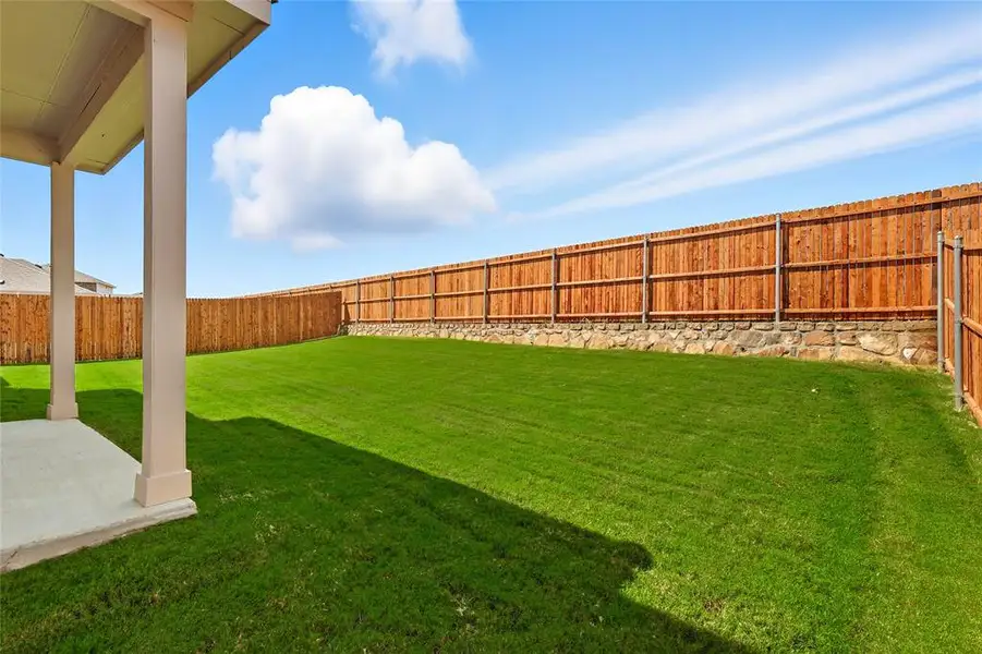 Fenced backyard featuring a patio Fenced backyard featuring a patio