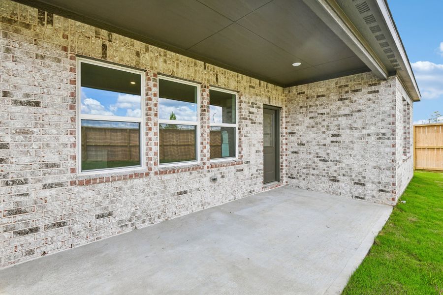 Exterior details and patio area of a home in Raburn Reserve 50s, Tomball (Image 3).