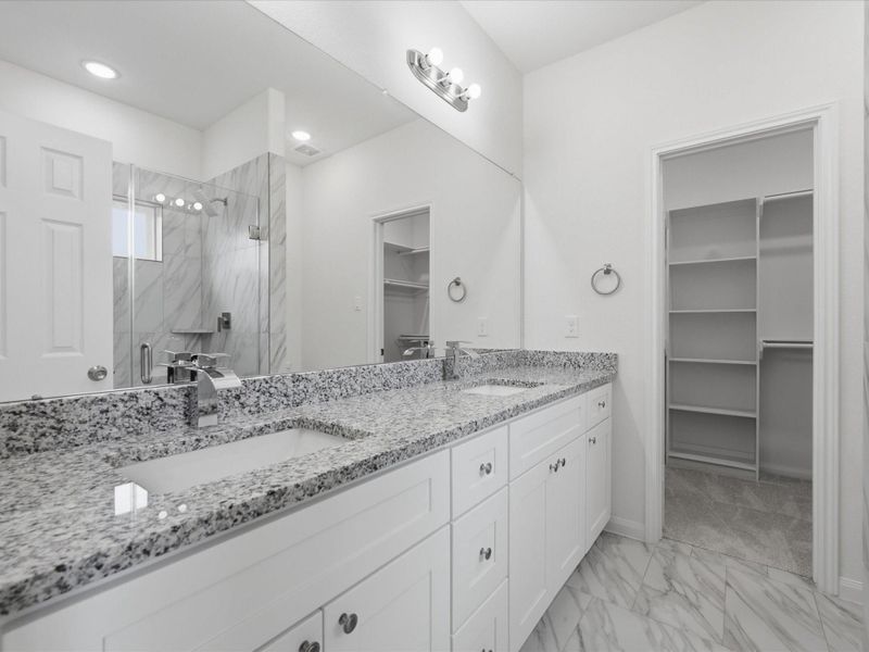 Start and end your day in a beautifully designed en-suite featuring dual sinks, a glass shower, and spacious walk-in closet. Start and end your day in a beautifully designed en-suite featuring dual sinks, a glass shower, and spacious walk-in closet.