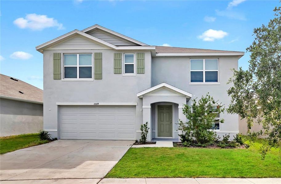 Front exterior of a new home in , Wimauma, FL, highlighting curb appeal (Image 23).