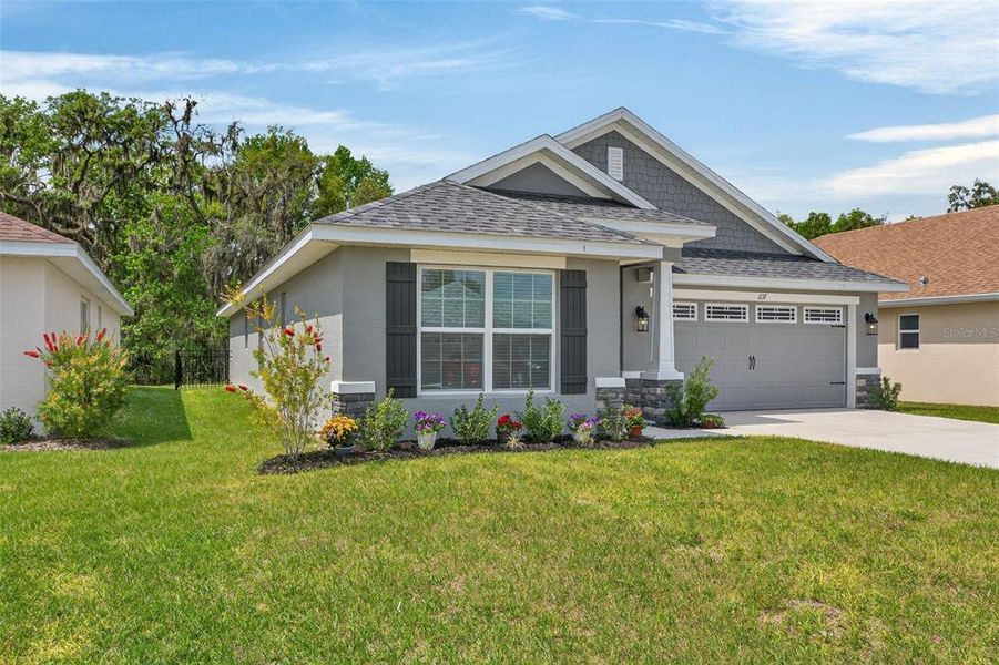 Front exterior of a new home in , Inverness, FL, highlighting curb appeal (Image 25).