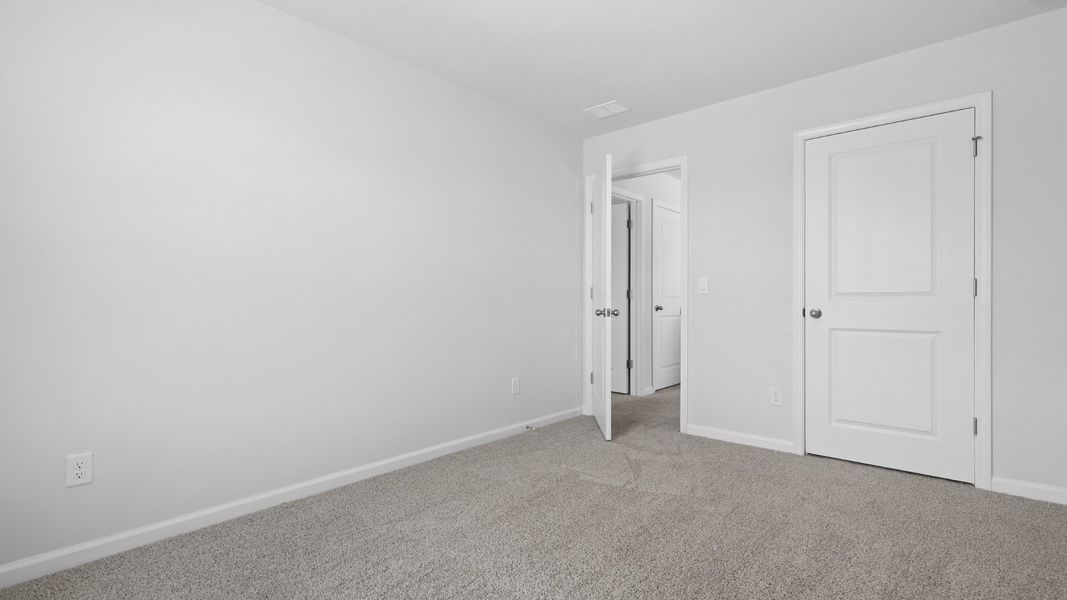 Representative unfurnished interior of a home built from the Aisle by D.R. Horton in Pine Hills at Cane Bay, Summerville (Image 19).