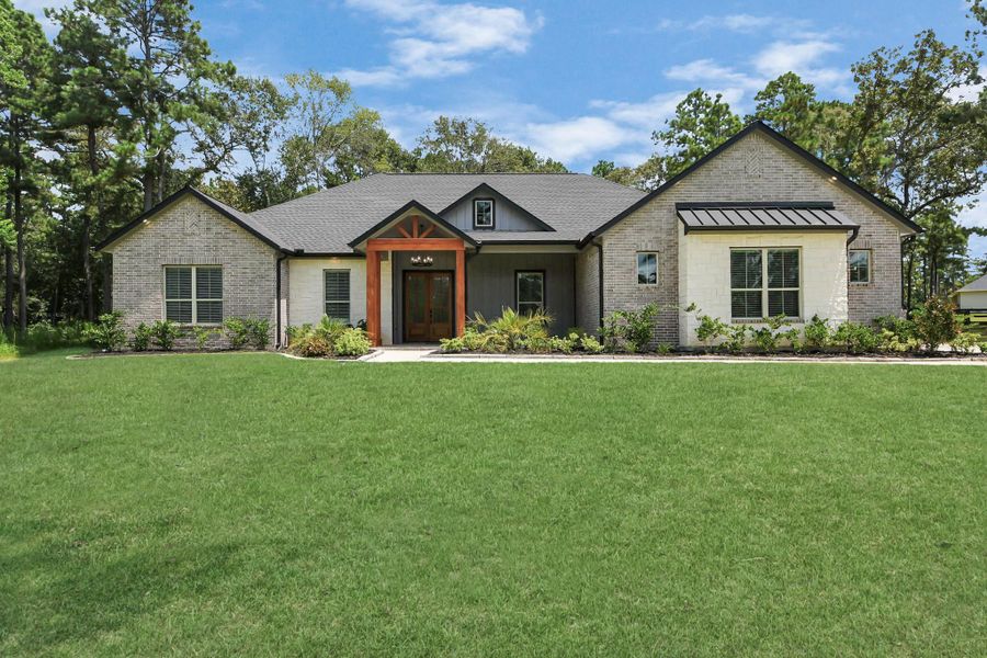 Front exterior of a new home in , Magnolia, TX, highlighting curb appeal (Image 19).