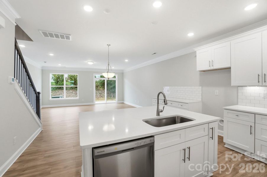 Open kitchen, breakfast area, and family room