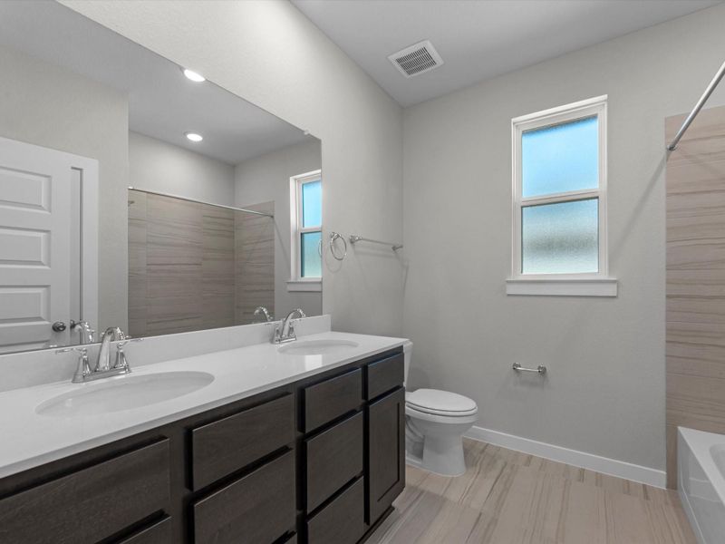 Furnished interior view inside a new home in Mason Woods, Cypress (Image 10).
