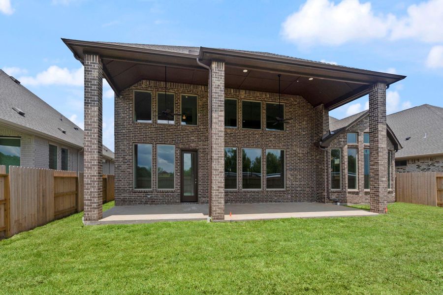 Front exterior of a new home in Coastal Point, League City, TX, highlighting curb appeal (Image 23).
