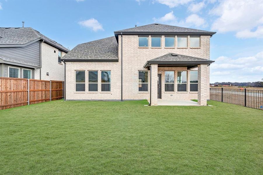 Exterior details and patio area of a home in Lily Creek at Sutton Fields, Aubrey (Image 2). Exterior details and patio area of a home in Lily Creek at Sutton Fields, Aubrey (Image 2).