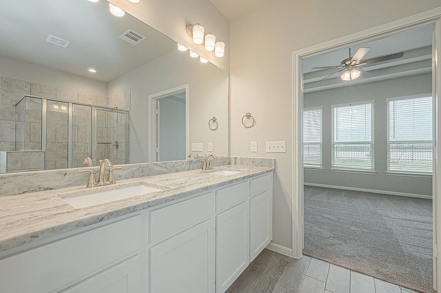 Representative furnished interior of a home built from the Floor Plan 2050 by Colina Homes in Grand Magnolia, Magnolia (Image 9).