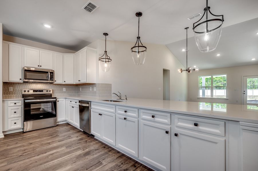 Furnished interior view inside a new home in Sunset Landing, Little River (Image 8).
