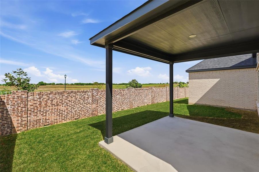 Fenced backyard featuring a patio Fenced backyard featuring a patio