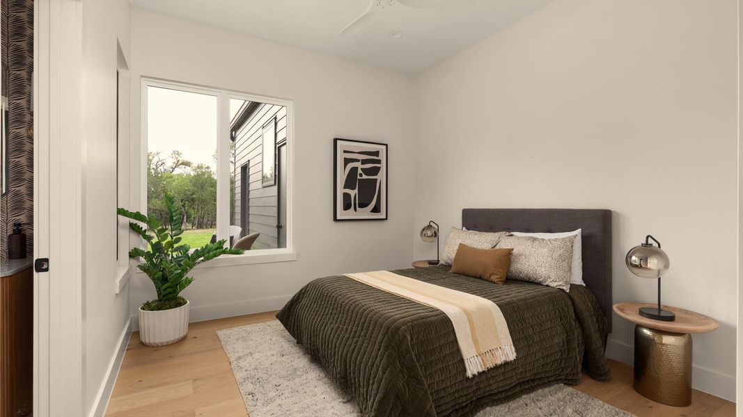 Hardwood floors and generous natural light elevate this inviting bedroom retreat. Hardwood floors and generous natural light elevate this inviting bedroom retreat.