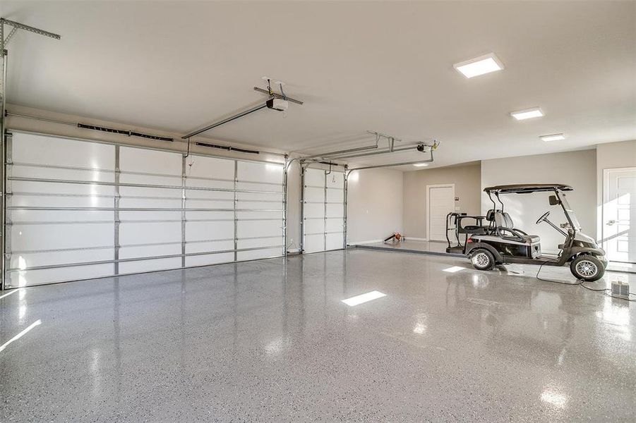 Garage featuring a garage door opener