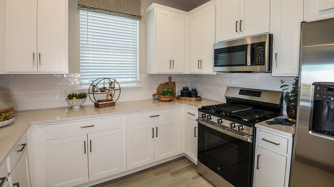 Furnished interior view inside a new home in Esplanade at Kingston, Estero (Image 13).