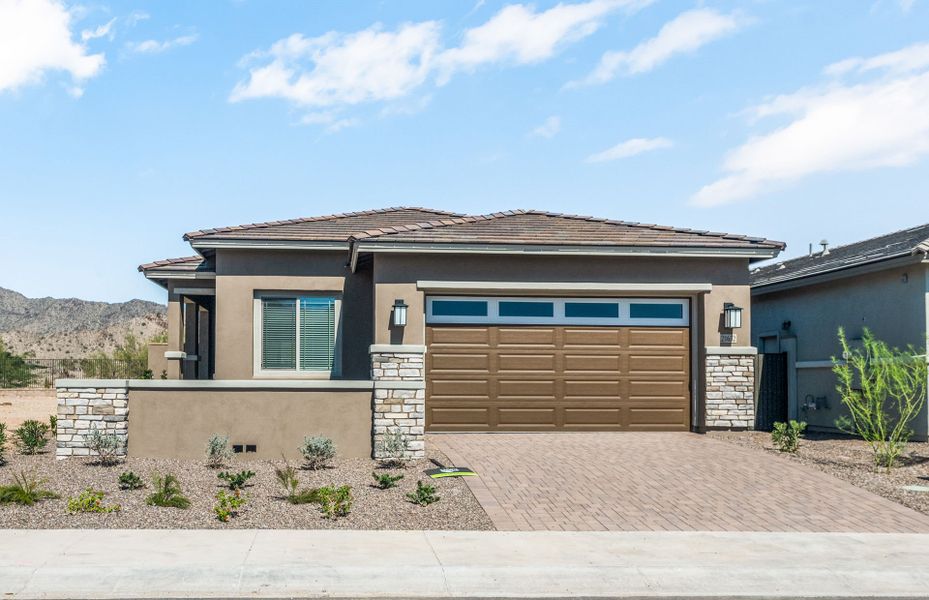 Front exterior of a new home in Regent Hills - Meadow Series, Buckeye, AZ, highlighting curb appeal (Image 2). Front exterior of a new home in Regent Hills - Meadow Series, Buckeye, AZ, highlighting curb appeal (Image 2).