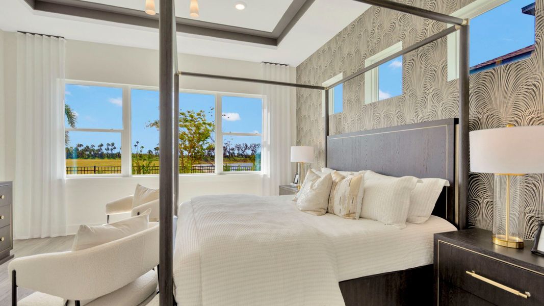 The Primary Bedroom of a DRB Homes Grand Eider model, which is a home plan offered at Serengeti in Spring Hill, FL.