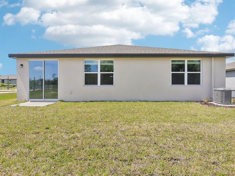 Exterior details and patio area of a home in The Reserve at Van Oaks, Auburndale (Image 3).