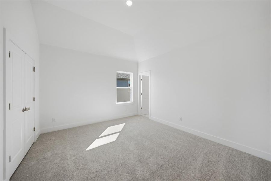 Carpeted empty room with baseboards Carpeted empty room with baseboards