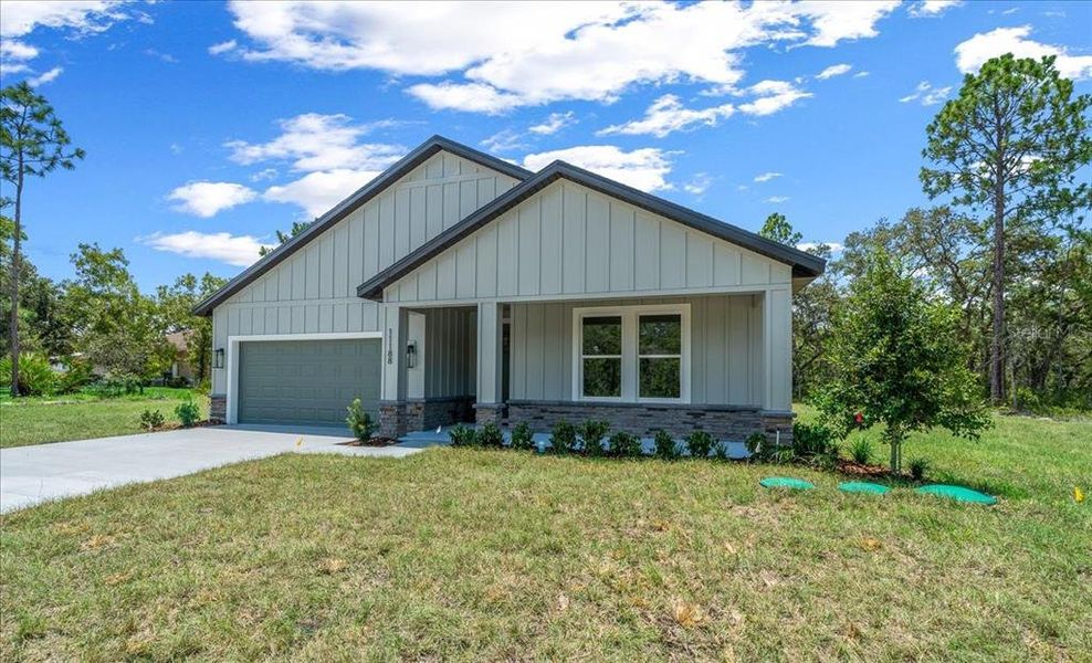 Front exterior of a new home in , Weeki Wachee, FL, highlighting curb appeal (Image 37). Front exterior of a new home in , Weeki Wachee, FL, highlighting curb appeal (Image 37).