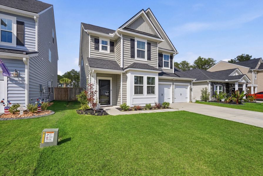 Front exterior of a new home in Cypress Preserve, Moncks Corner, SC, highlighting curb appeal (Image 28). Front exterior of a new home in Cypress Preserve, Moncks Corner, SC, highlighting curb appeal (Image 28).