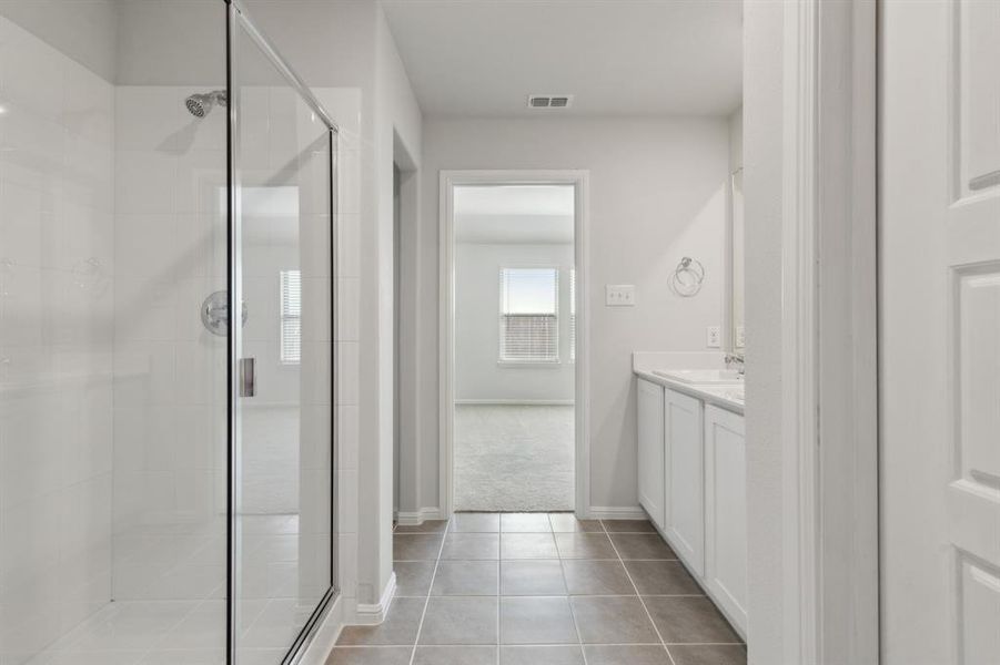Primary Bathroom in the Hayden home plan by Trophy Signature Homes – REPRESENTATIVE PHOTO Primary Bathroom in the Hayden home plan by Trophy Signature Homes – REPRESENTATIVE PHOTO