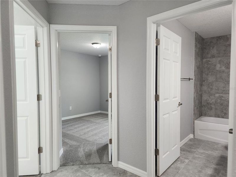 Guest bedroom hallway with linen closet