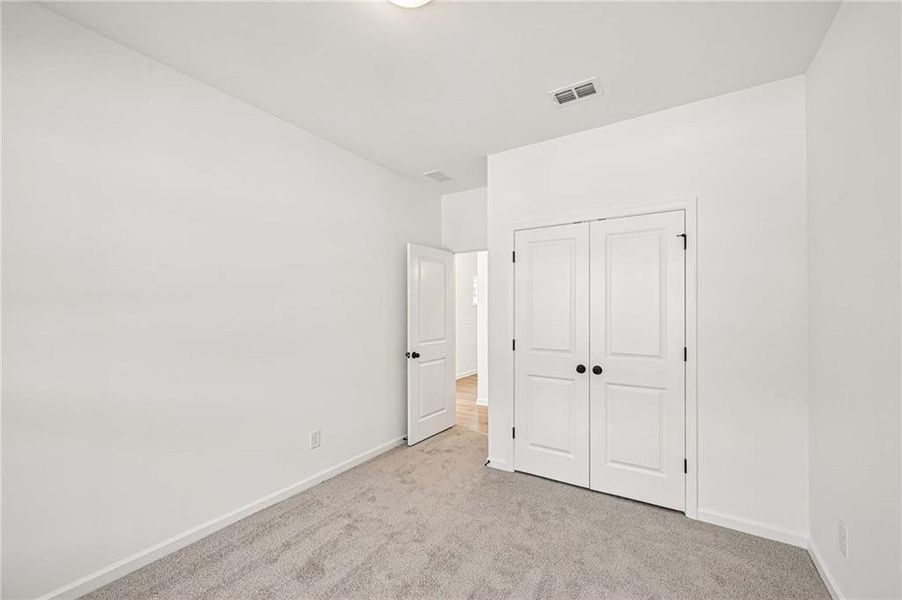 Spacious, unfurnished interior of a new home in Eastlyn Crossing, Flowery Branch (Image 28).