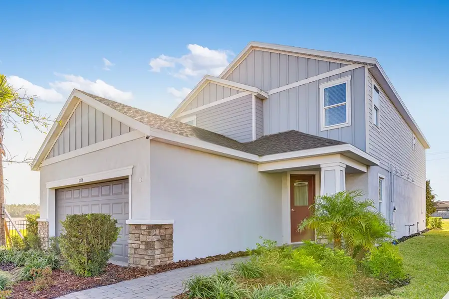Front exterior of a new home in Center Lake Ranch Community Group Page, St. Cloud, FL, highlighting curb appeal (Image 24).
