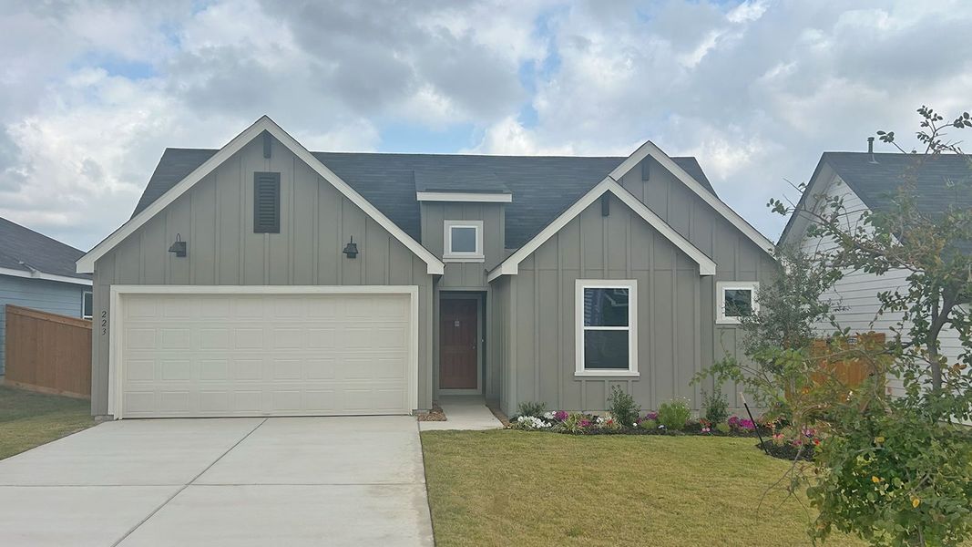 Front exterior of a new home in Trace, San Marcos, TX, highlighting curb appeal (Image 1). Front exterior of a new home in Trace, San Marcos, TX, highlighting curb appeal (Image 1).