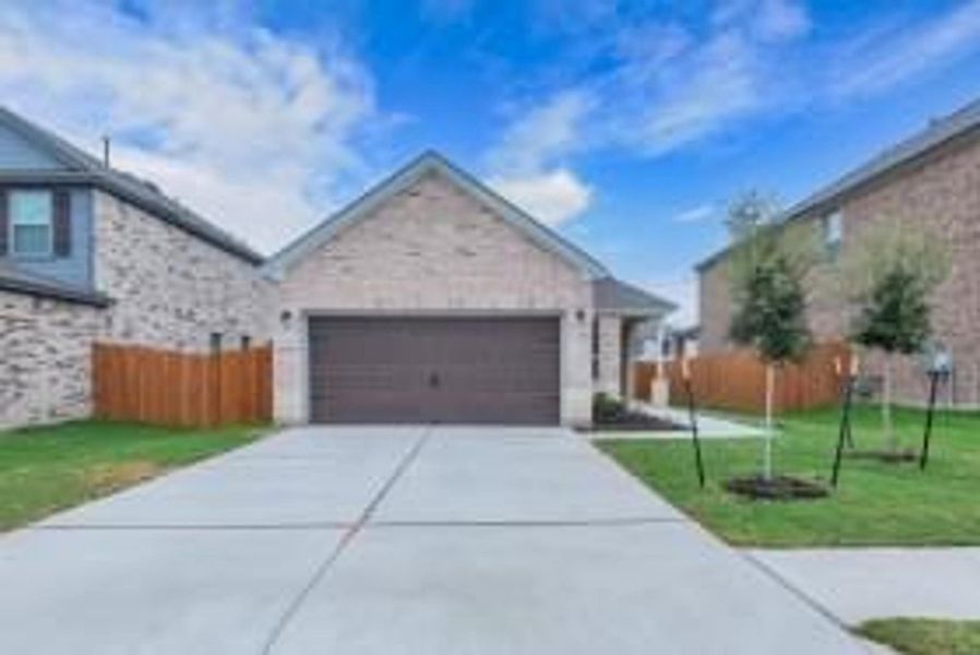 Front exterior of a new home in Salerno - Heritage Collection, Round Rock, TX, highlighting curb appeal (Image 18). Front exterior of a new home in Salerno - Heritage Collection, Round Rock, TX, highlighting curb appeal (Image 18).