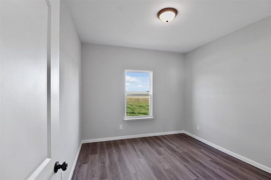 Unfurnished room with wood-type flooring