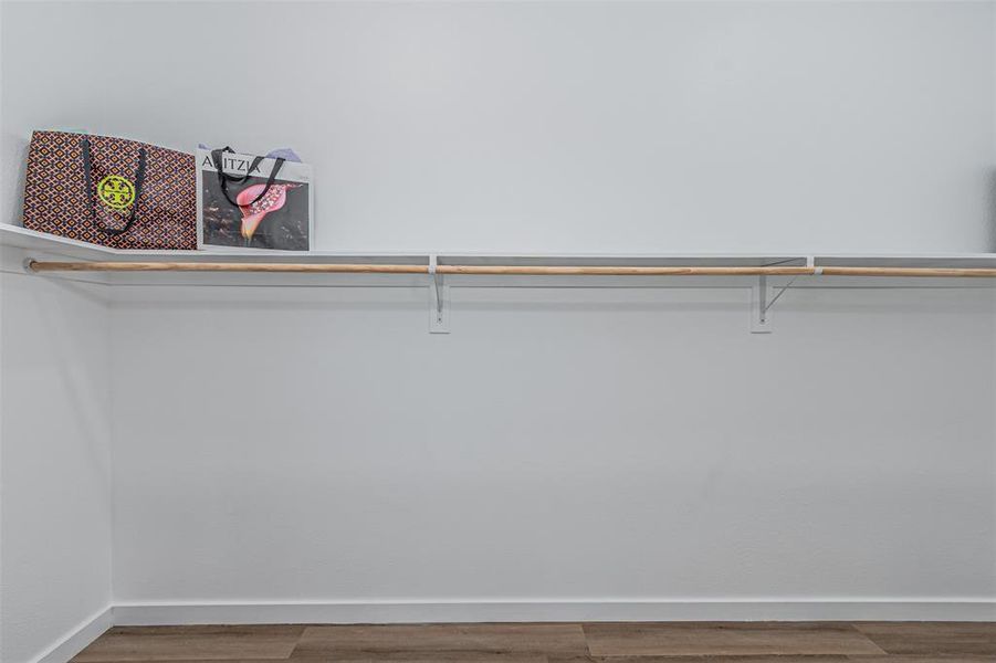 Walk in closet featuring light wood-type flooring