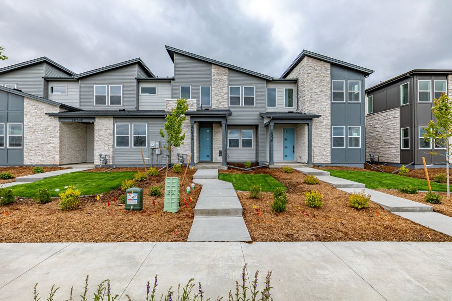 Front exterior of a new home in Painted Prairie, Aurora, CO, highlighting curb appeal (Image 19). Front exterior of a new home in Painted Prairie, Aurora, CO, highlighting curb appeal (Image 19).