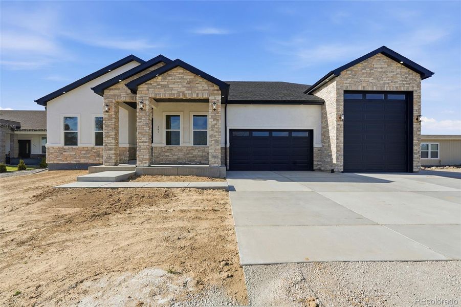 Front exterior of a new home in , Keenesburg, CO, highlighting curb appeal (Image 2).