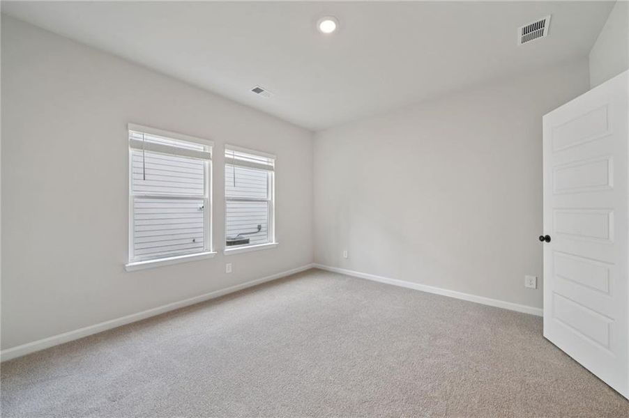 Spacious, unfurnished interior of a new home in Vines at Mill Creek - Estate Series, Braselton (Image 22).