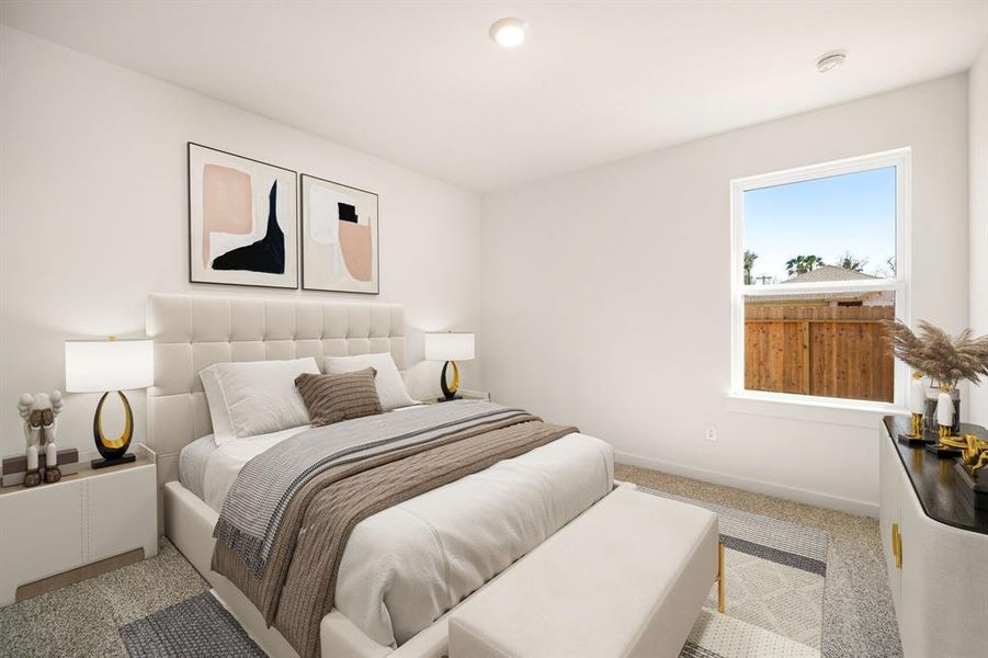 Secondary bedroom features plush carpet, lighting and a large window.