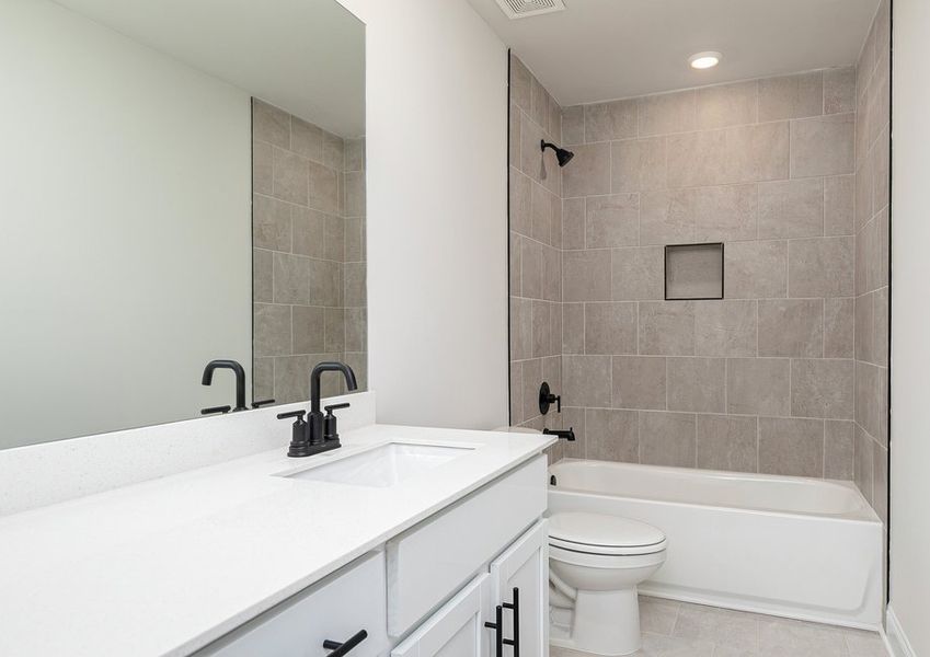 Your guests will have plenty of room to get ready in this secondary bathroom