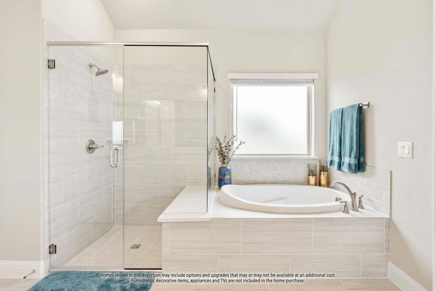 Master bathroom with glass-enclosed walk-in shower and oval soaking tub with tile surround Master bathroom with glass-enclosed walk-in shower and oval soaking tub with tile surround