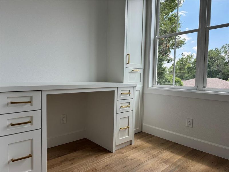 Unfurnished office featuring light wood-type flooring