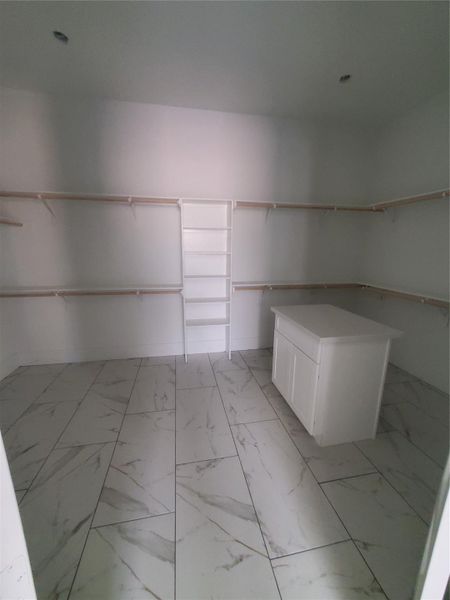MASSIVE PRIMARY CLOSET WITH ISLAND FOR EXTRA STORAGE