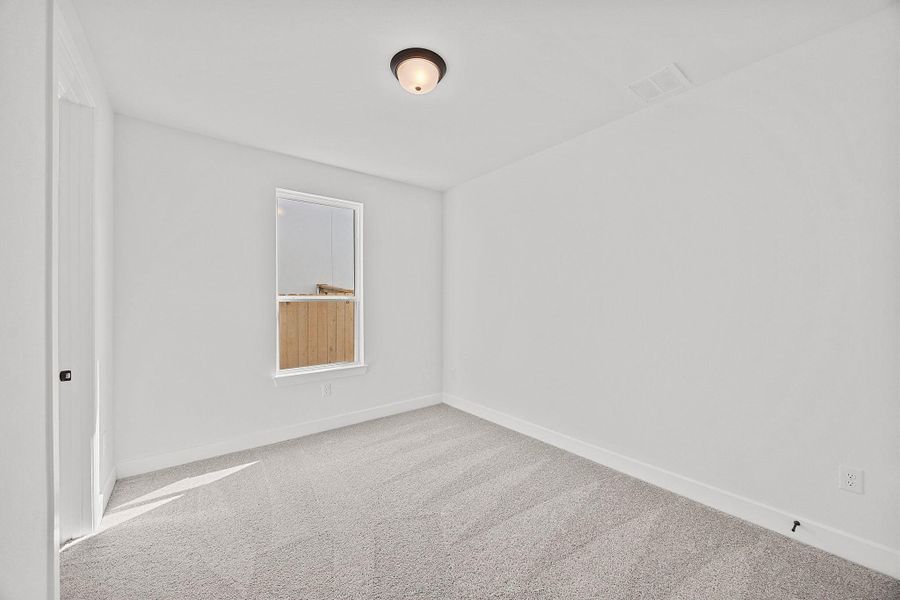 Spacious, unfurnished interior of a new home in The Colony, Bastrop (Image 30).