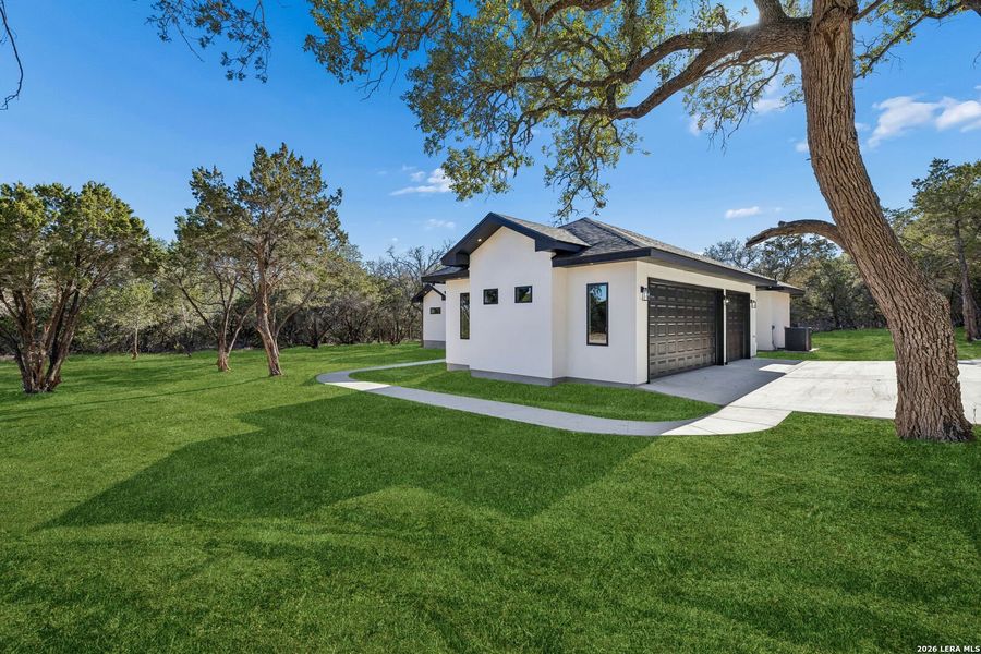 Front exterior of a new home in , Spring Branch, TX, highlighting curb appeal (Image 34).