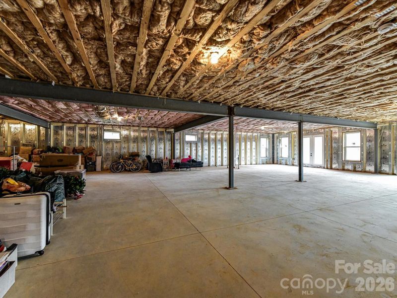 Expansive unfinished basement offering a wide-open layout with endless potential for customization and additional living space.