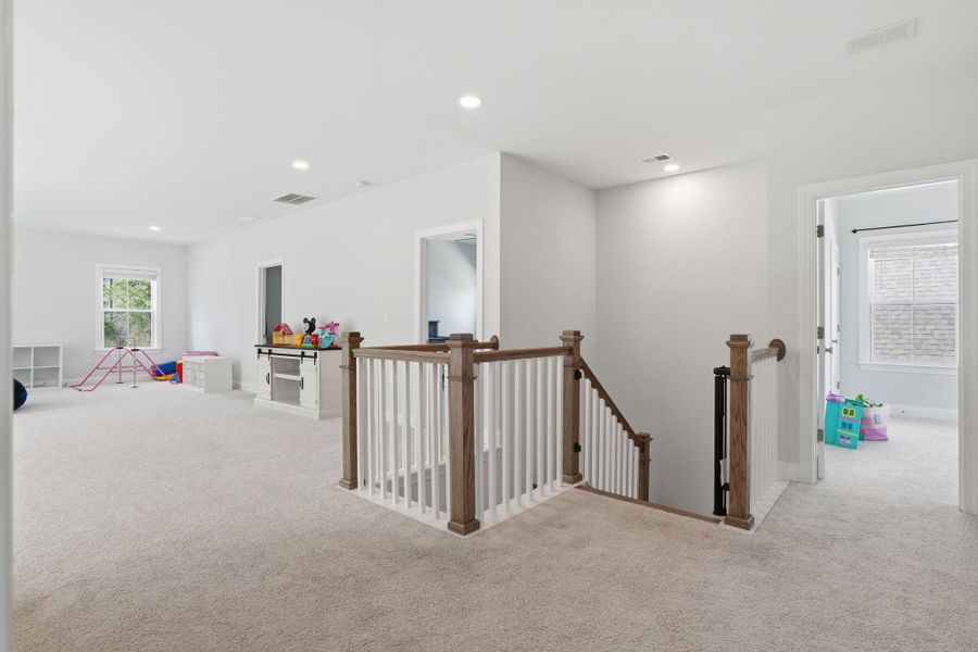 Furnished interior view inside a new home in Tidewater at Lakes of Cane Bay, Summerville (Image 46).